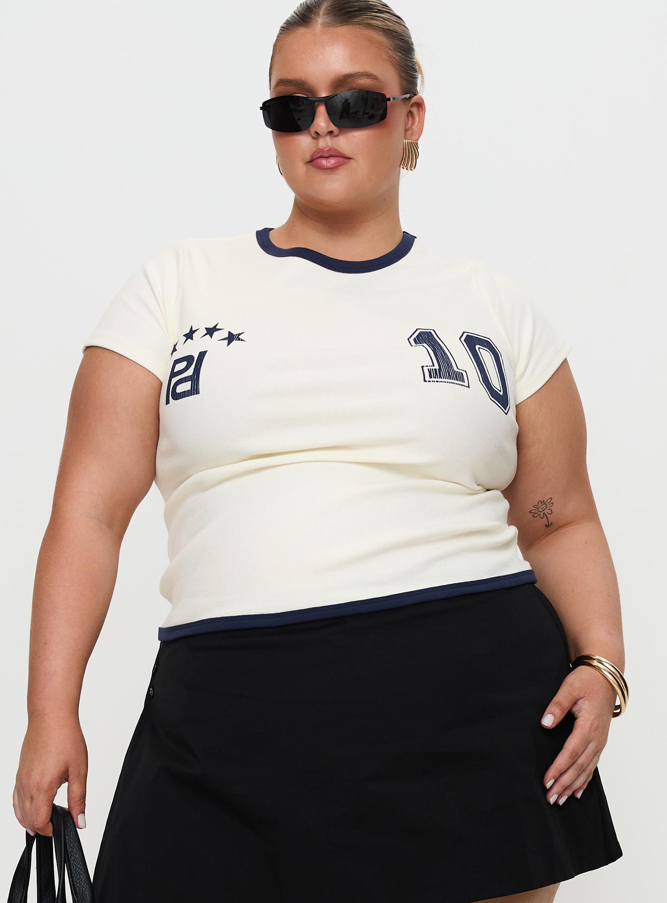 front view of model wearing Princess Polly Track Record Graphic Top Cream Curve Short Sleeves Crew Neck 