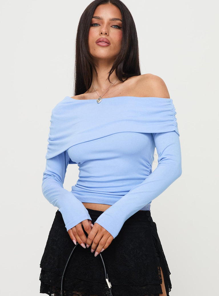 side view of model wearing Princess Polly Woolton Long Sleeve Top Blue Full Sleeves Asymmetric Neckline 