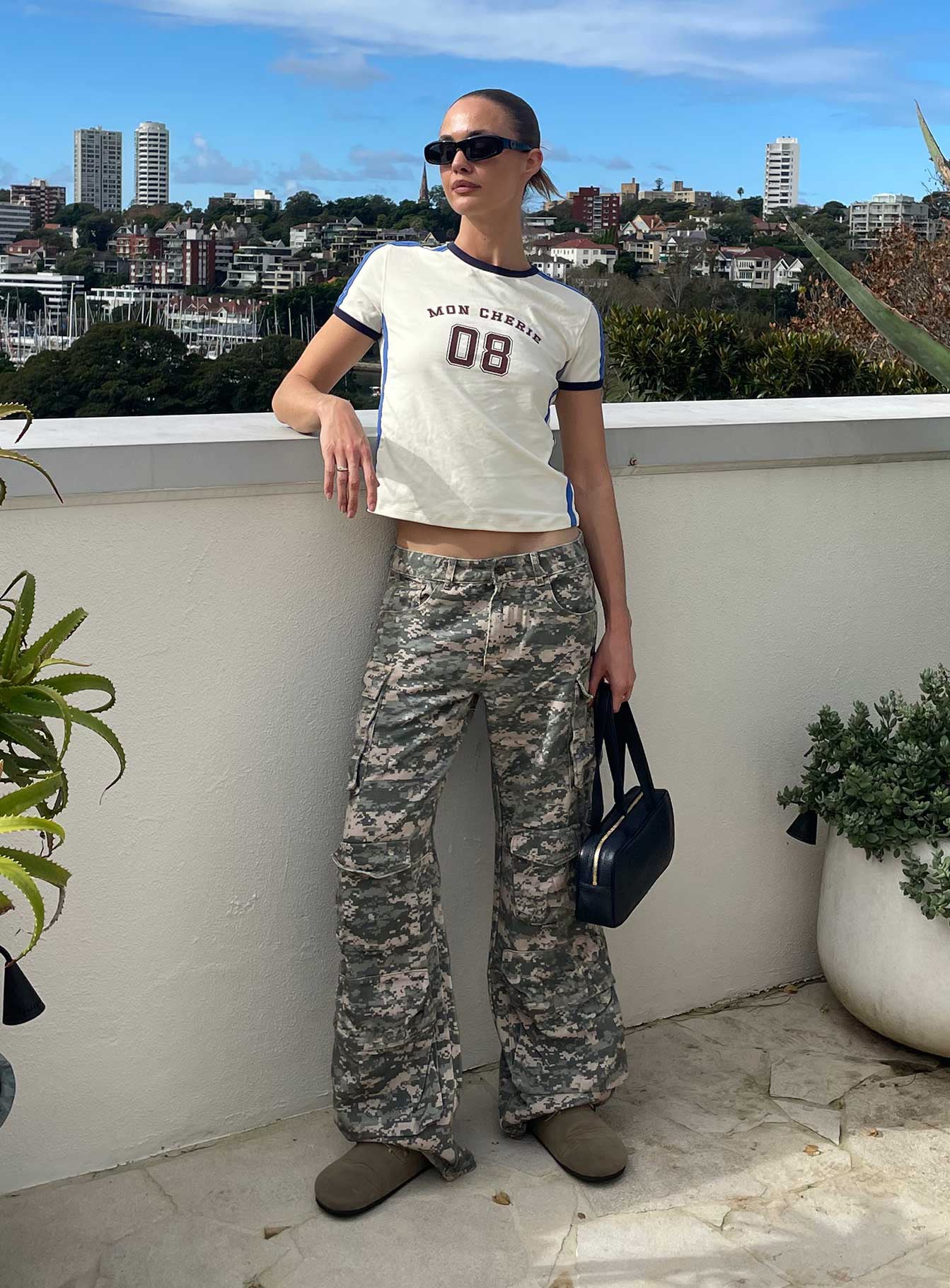front view of model wearing Princess Polly Sweetness Low Rise Straight Leg Jeans Digital Camo Low Rise Jeans 