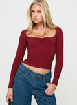 front view of model wearing Princess Polly Selenie Long Sleeve Top Red Full Sleeves Square Neck 