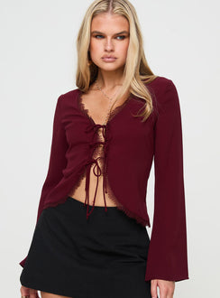 front view of model wearing Princess Polly Hagner Long Sleeve Top Burgundy Full Sleeves V-Neck 