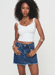 Denim skort High rise fit, classic five pocket design, belt looped waist, zip & button fastening, branded patch at back, raw edge hem Non-stretch material, unlined  Princess Polly Lower Impact 