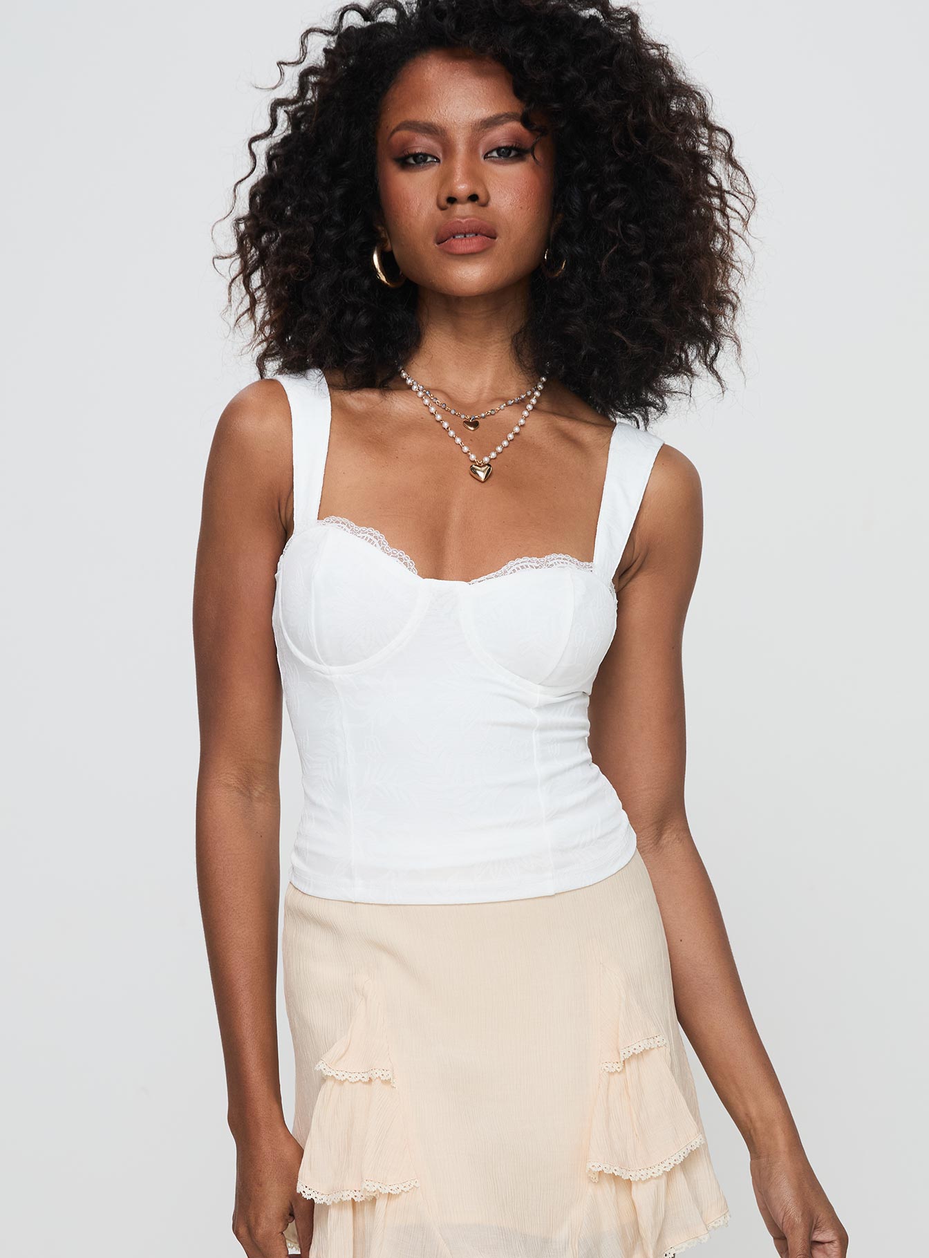 front view of model wearing Princess Polly Hazeel Top White Sleeveless Sweetheart 