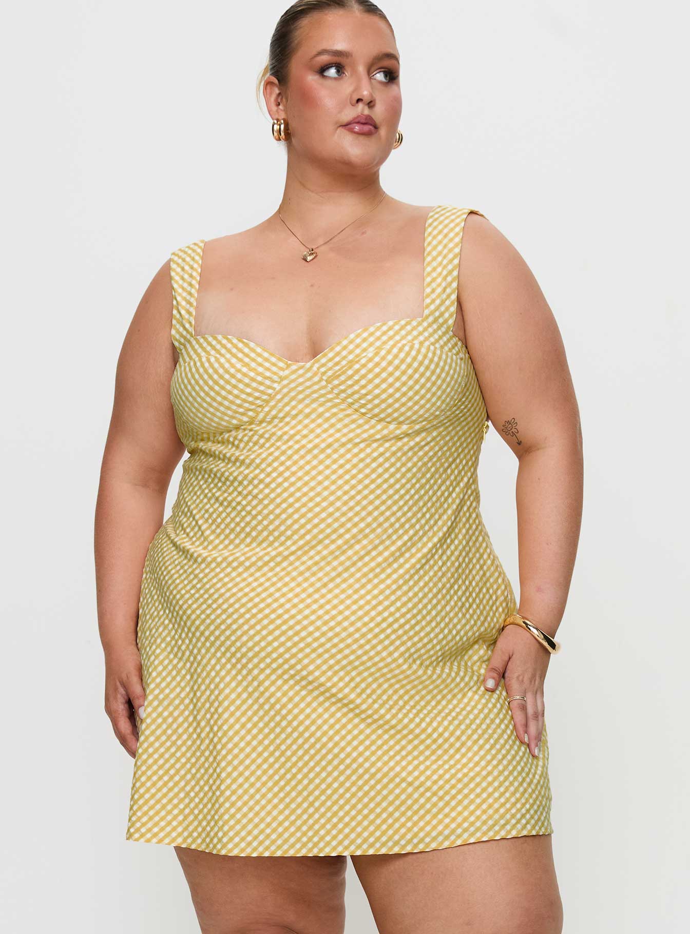back view of model wearing Princess Polly Mcbeath Mini Dress Yellow Curve Sweetheart Neckline 