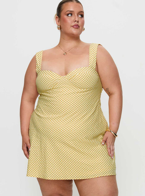 back view of model wearing Princess Polly Mcbeath Mini Dress Yellow Curve Sweetheart Neckline 