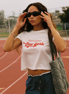 side view of model wearing Princess Polly East Coast Nyc Tee White Short Sleeves Crew Neck 