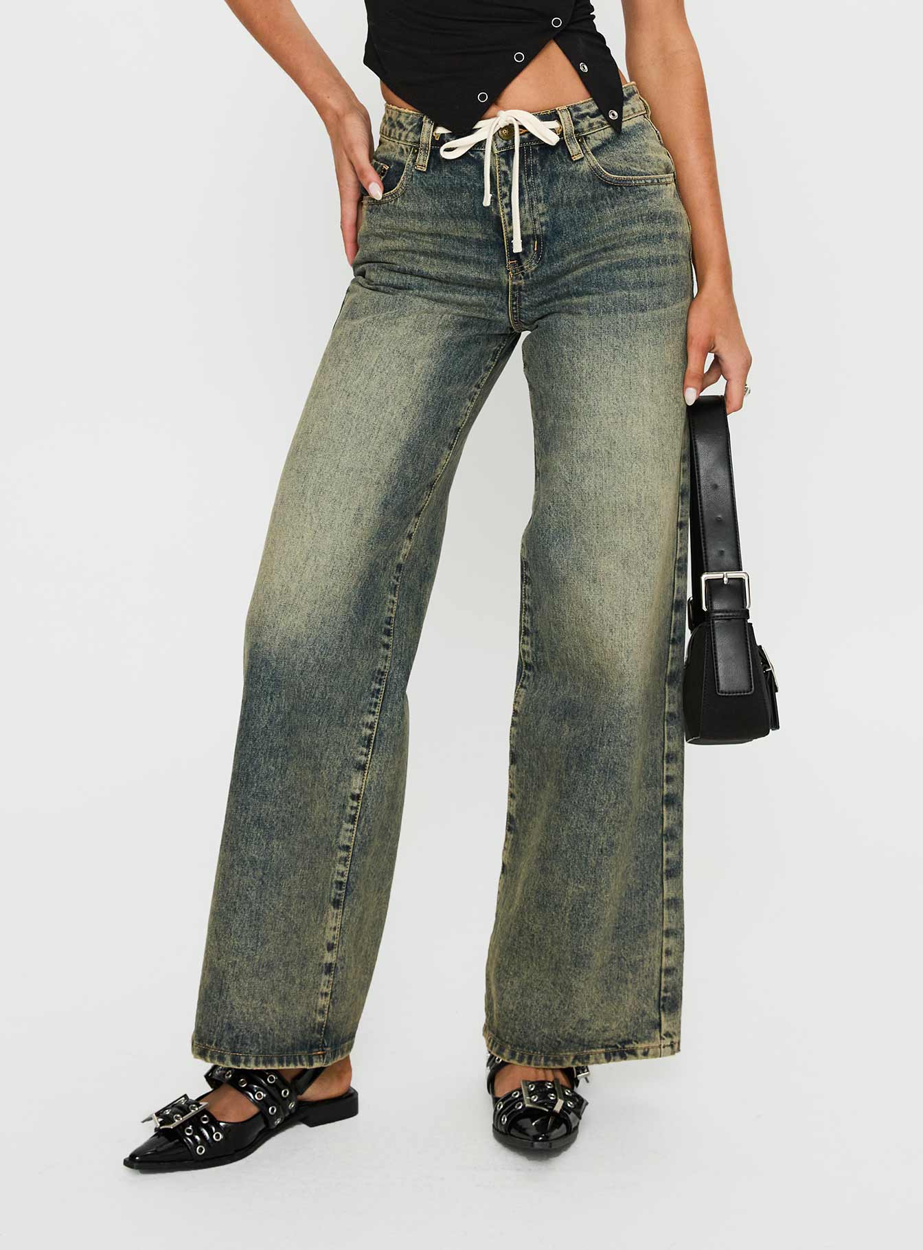 front view of model wearing Princess Polly Mellowed Out Slouchy Jeans Antique Wash Mid Rise 