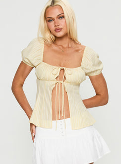 front view of model wearing Princess Polly How To Fly Tie Detail Top Yellow Short Sleeves Square Neck 