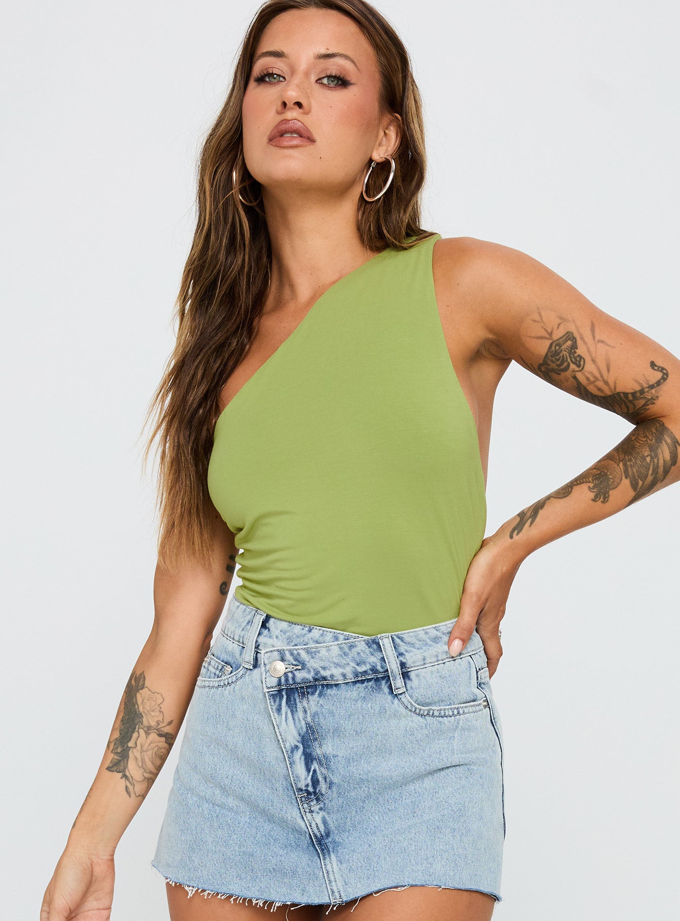 front view of model wearing Princess Polly Ferrera One Shoulder Bodysuit Green Sleeveless 