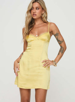 side view of model wearing Princess Polly Dale Mini Dress Lemon Plunger 