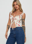 Floral crop top Fixed shoulder straps, lace trim, tie fastening at bust, split hem Non-stretch material, fully lined 