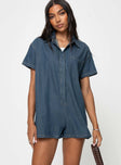 Dark wash denim romper Classic collar, button fastening down front, chest pocket, drop shoulder Non-stretch material, unlined 