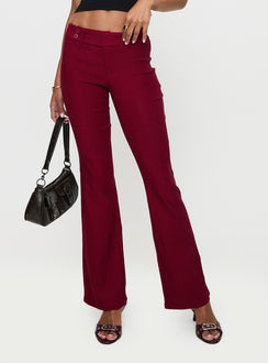 side view of model wearing Princess Polly Kinkirk Flared Pants Burgundy Low Rise Pants 