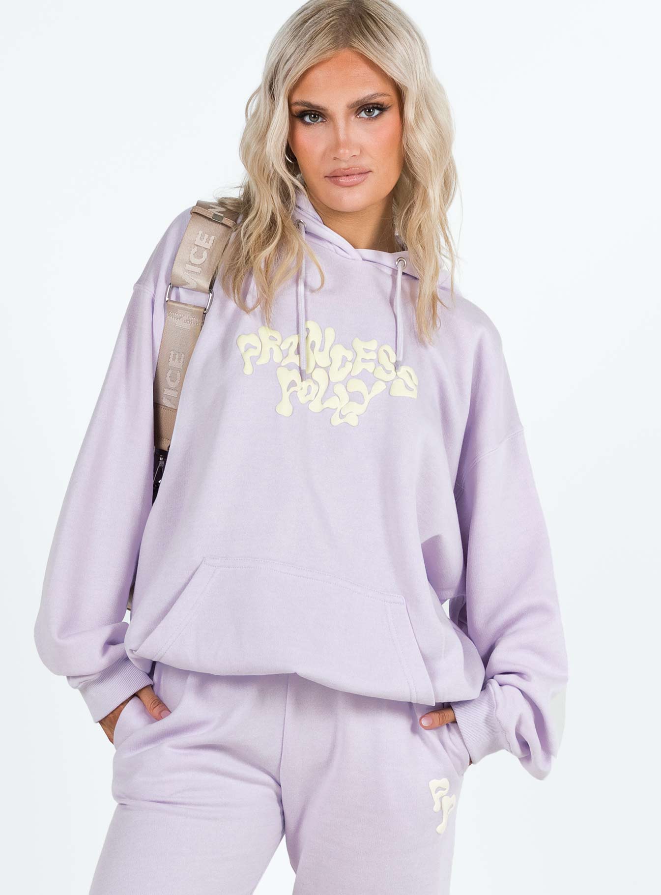 front view of model wearing Princess Polly Princess Polly Hooded Sweatshirt Squiggle Text Dusty Mauve / Eggshell regular 