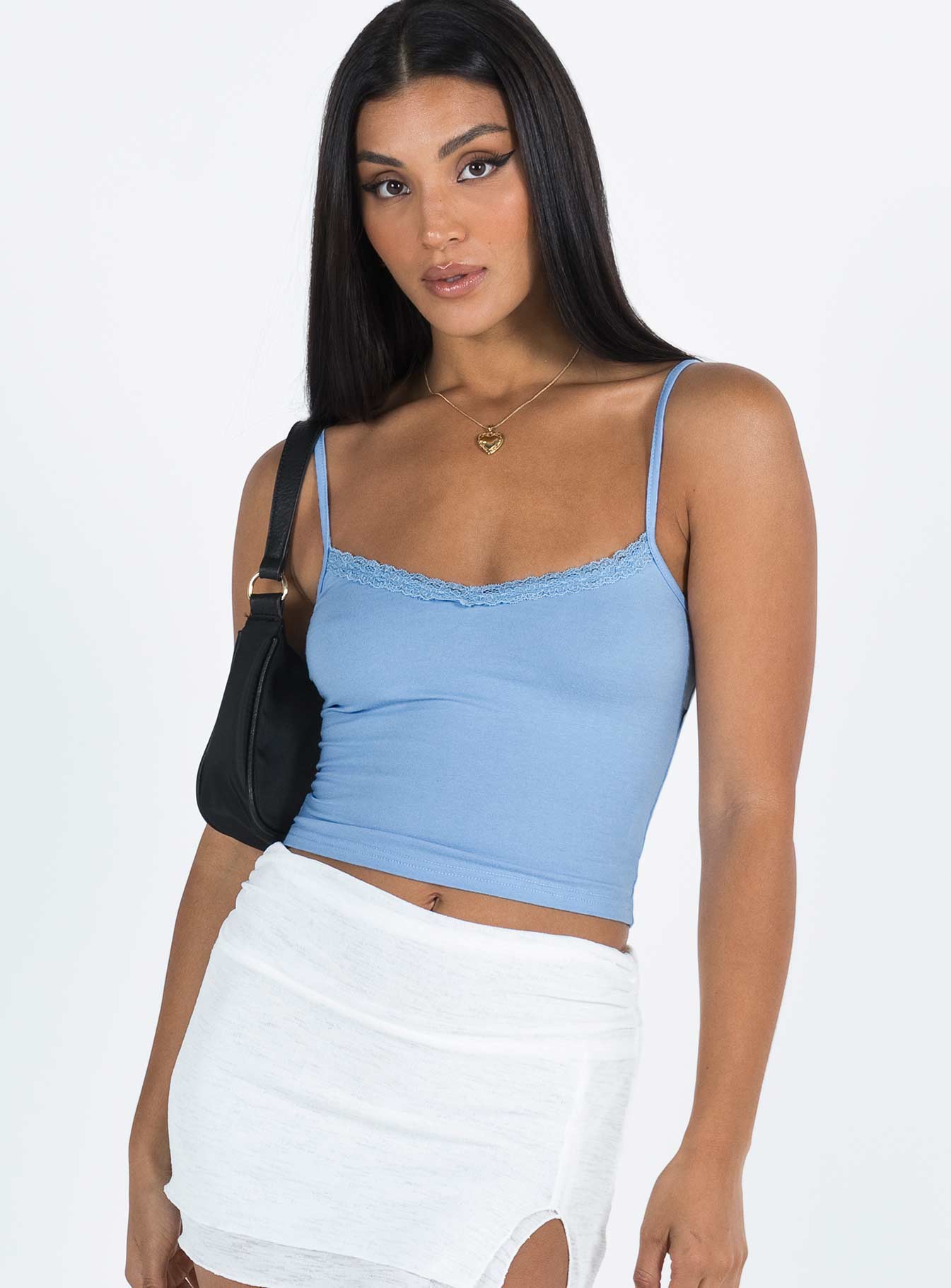 Front view of model wearing  front Princess Polly Sleeveless Square Neck  Armer Top Blue