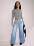 side view of model wearing Princess Polly Pearlisle Baggy Jeans Light Wash Low Rise Jeans 