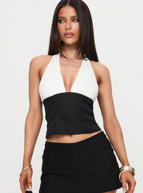 front view of model wearing Princess Polly Eyecatcher Halter Top Multi Sleeveless Plunger 