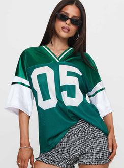 front view of model wearing Princess Polly Kronwall Sports Jersey Top Green / White Three Fourth Sleeves V-Neck 