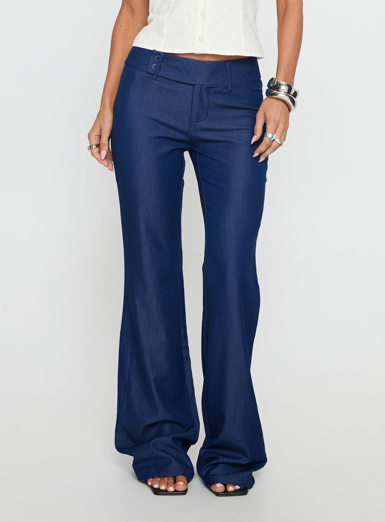 side view of model wearing Princess Polly Kinkirk Flared Pants Chambray Mid Rise Pants 