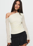 front view of model wearing Princess Polly Beller Long Sleeve Lace Top Cream Full Sleeves Asymmetric Neckline 