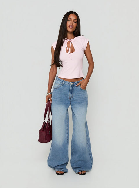 Showcasing Lokura Low Rise Super Baggy Jeans Vintage Mid Blue Wash womens-jeans front view of model wearing Princess Polly
