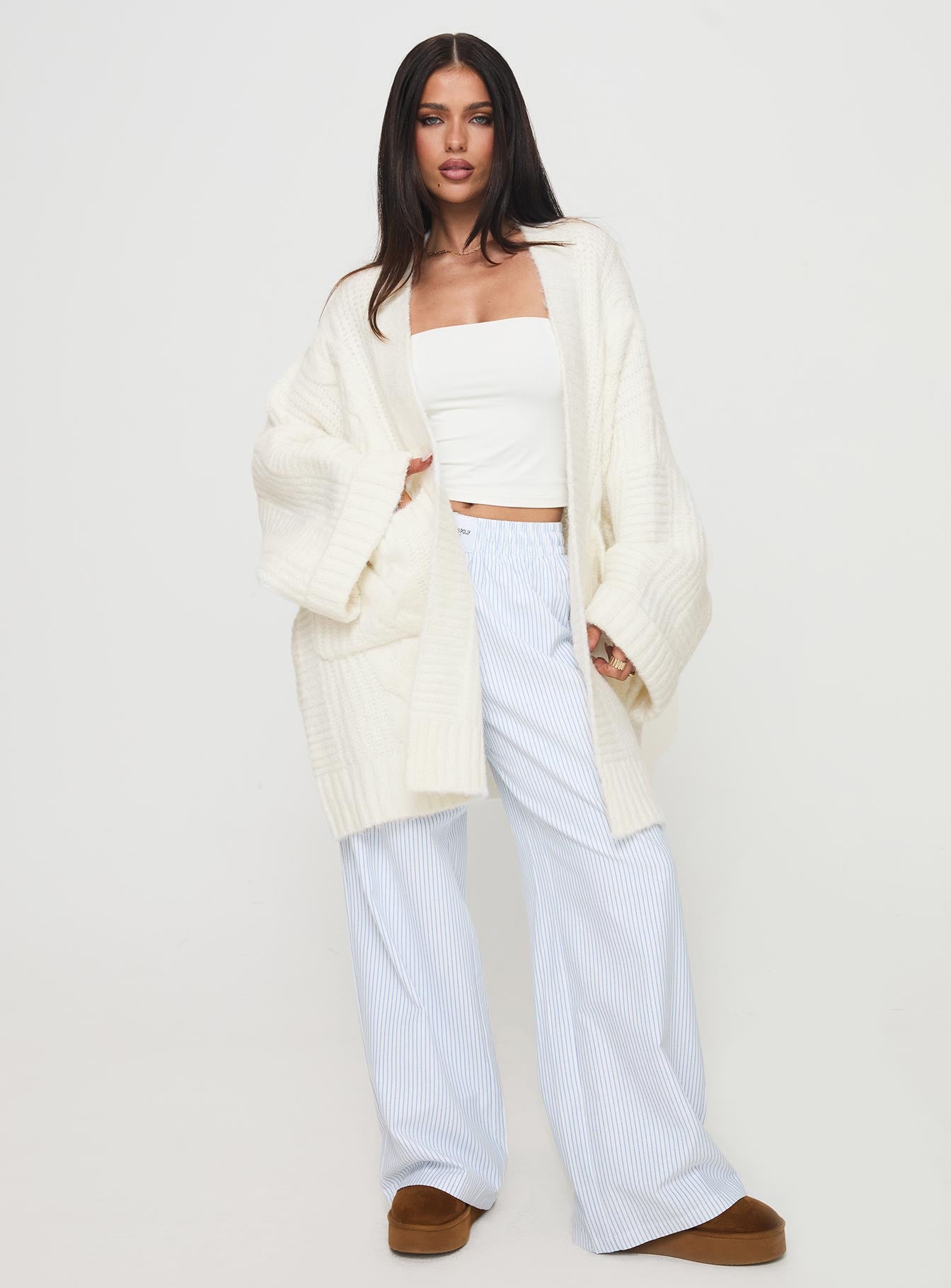 front view of model wearing Princess Polly Paisleigh Cable Knit Cardigan Cream Long 