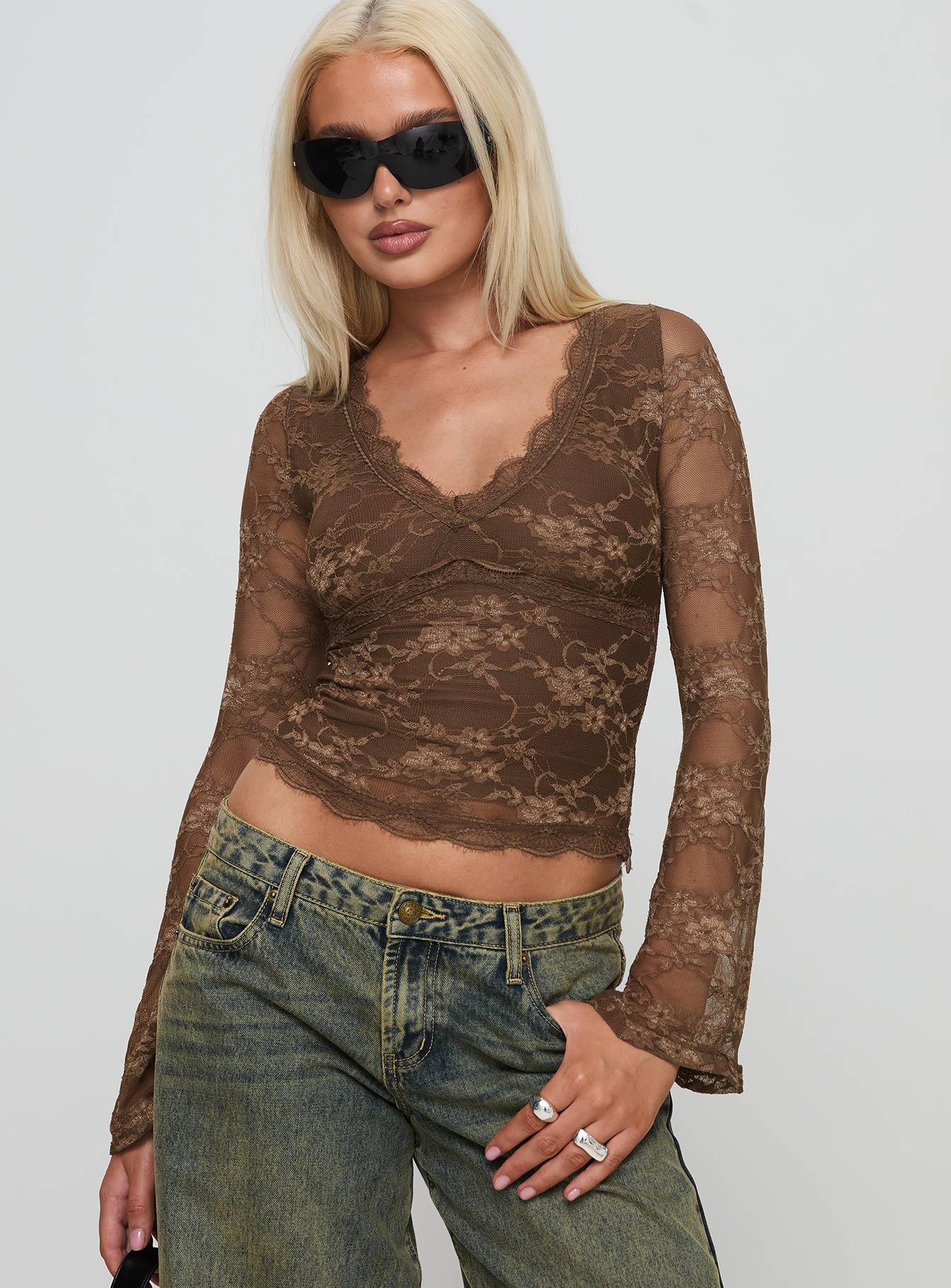 front view of model wearing Princess Polly Pitter Long Sleeve Top Brown Full Sleeves V-Neck 