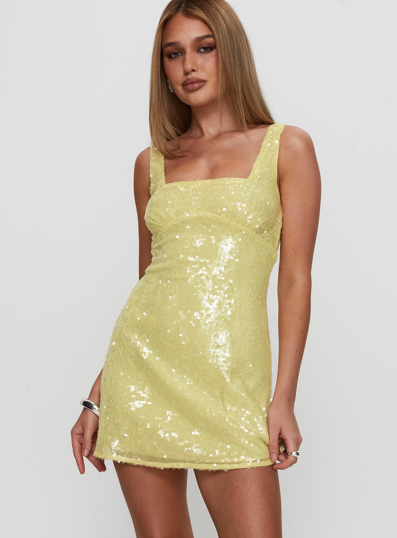 back view of model wearing Princess Polly Dasha Mini Dress Yellow Sequin Square Neck 
