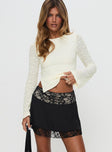   side view of model wearing Princess Polly Getaway Car Lace Mini Skirt Black Mini Skirts 