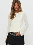 front view of model wearing Princess Polly Shellee Long Sleeve Tie Back Top Cream Full Sleeves Crew Neck 