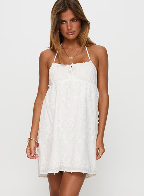 side view of model wearing Princess Polly Daisy Chains Broderie Halter Mini Dress White Scoop Neck 