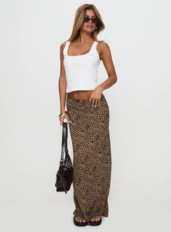   side view of model wearing Princess Polly Saffrone Maxi Skirt Leopard Maxi 