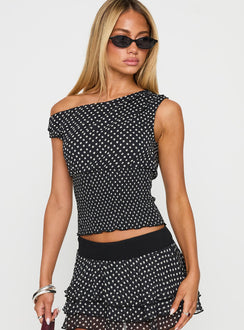 front view of model wearing Princess Polly Ready To Party Off Shoulder Top Black Polka Sleeveless Asymmetric Neckline 