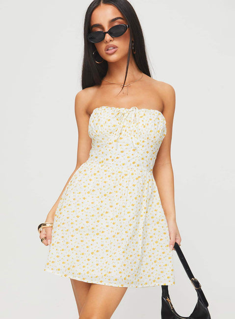 side view of model wearing Princess Polly Calidora Strapless Mini Dress Orange Floral Straight Neck 