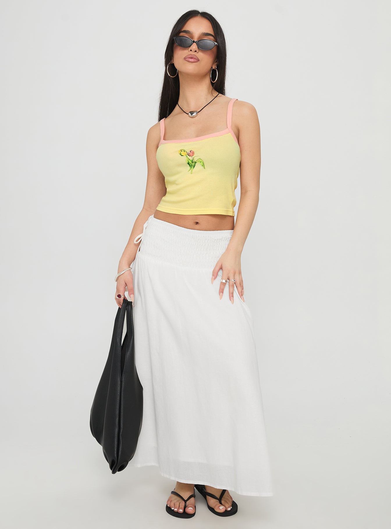   side view of model wearing Princess Polly Vence Ruched Maxi Skirt White Maxi 