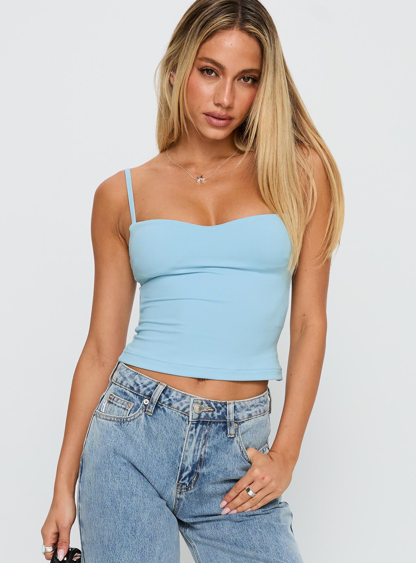 front view of model wearing Princess Polly Evanda Top Light Blue Sleeveless Sweetheart 