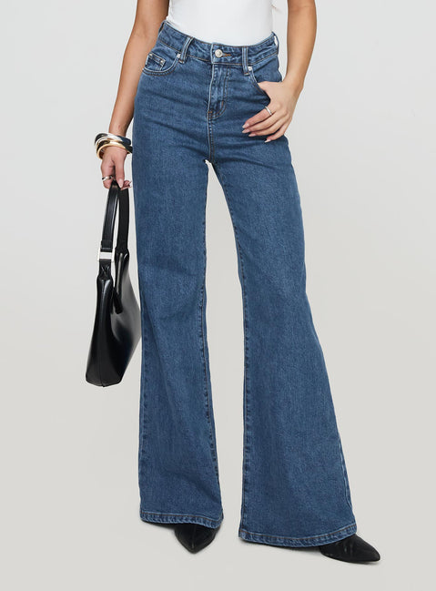 front view of model wearing Princess Polly Lucille High Rise Flare Leg Jeans Mid Wash High Waisted 