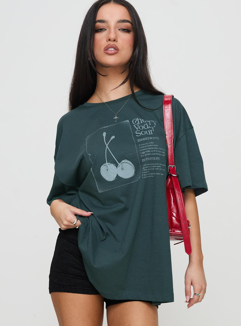 front view of model wearing Princess Polly Sour Cherry Oversized Tee Moss Green Half Sleeves Crew Neck 