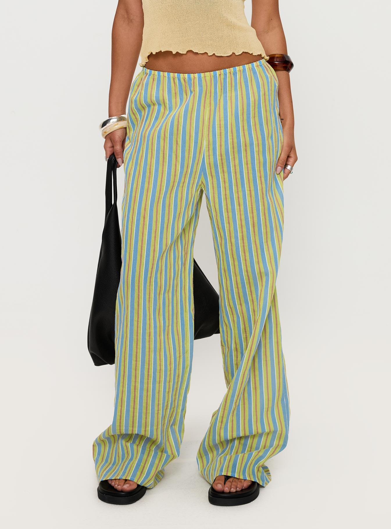 side view of model wearing Princess Polly Limestone Pants Multi Low Rise Pants 