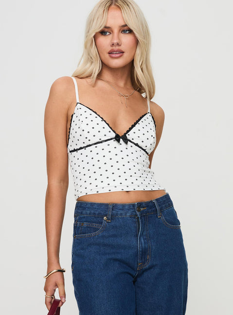 side view of model wearing Princess Polly Rune Top White / Black Sleeveless Plunger 