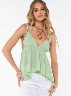 Front view of model wearing  front Princess Polly Sleeveless Square Neck  Hearts Flutter Top Green