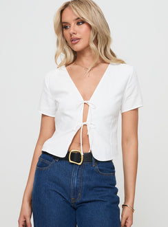 front view of model wearing Princess Polly Corriander Shirt White Short Sleeves V-Neck 