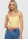 front view of model wearing Princess Polly Franca Top Yellow Sleeveless Sweetheart 