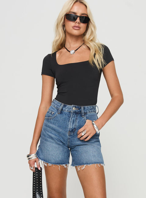 front view of model wearing Princess Polly Hayelle Denim Shorts Mid Blue High Waisted Shorts 