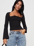 front view of model wearing Princess Polly Linsley Long Sleeve Top Black Full Sleeves Square Neck 