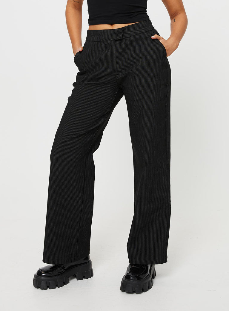 front view of model wearing Princess Polly Jeller Pinstripe Pants Black Tall High Waisted Pants 