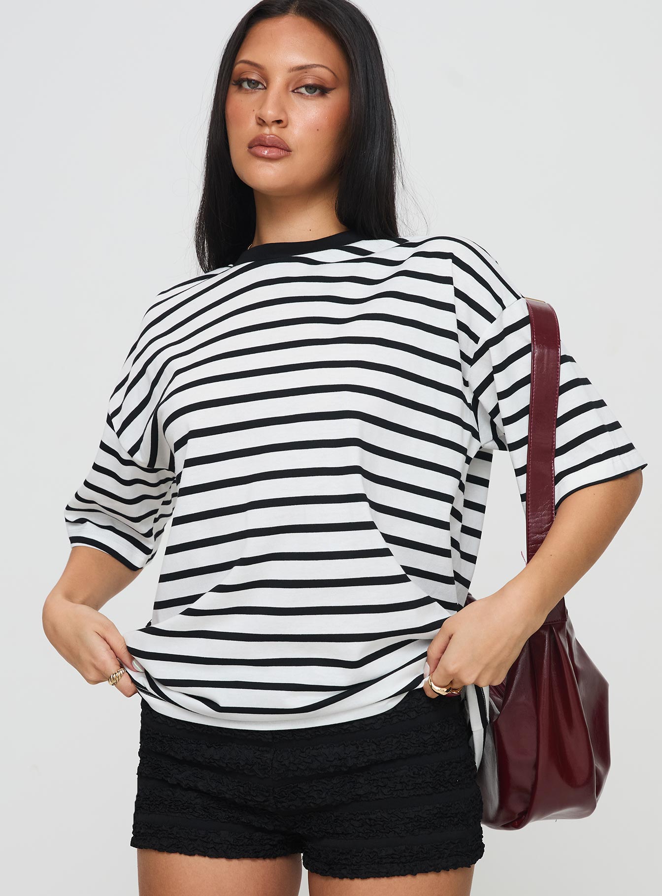 front view of model wearing Princess Polly Nersa Oversized Tee Black/white Stripe Half Sleeves Crew Neck 