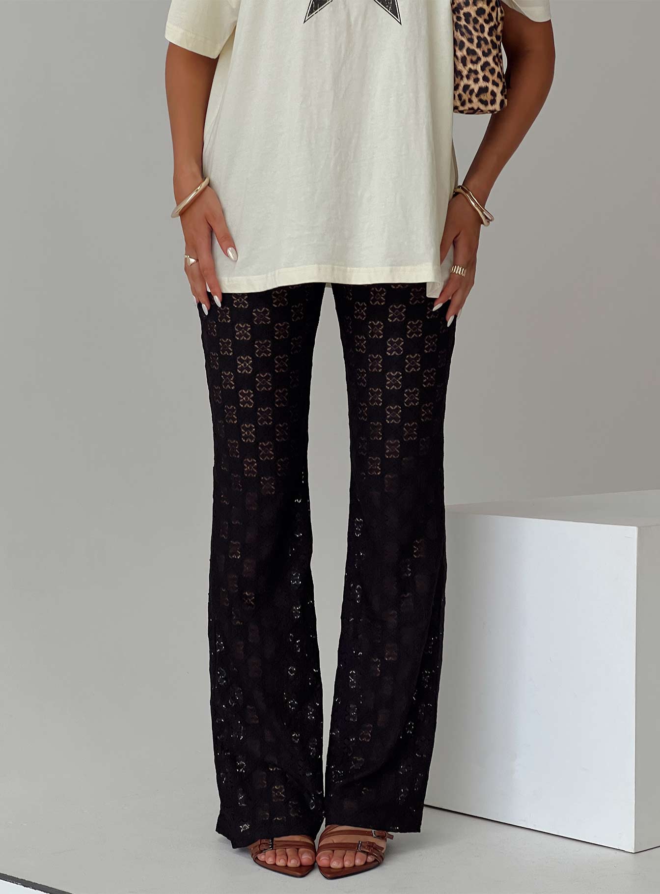 back view of model wearing Princess Polly Jubilee Flare Pants Black High Waisted Pants 