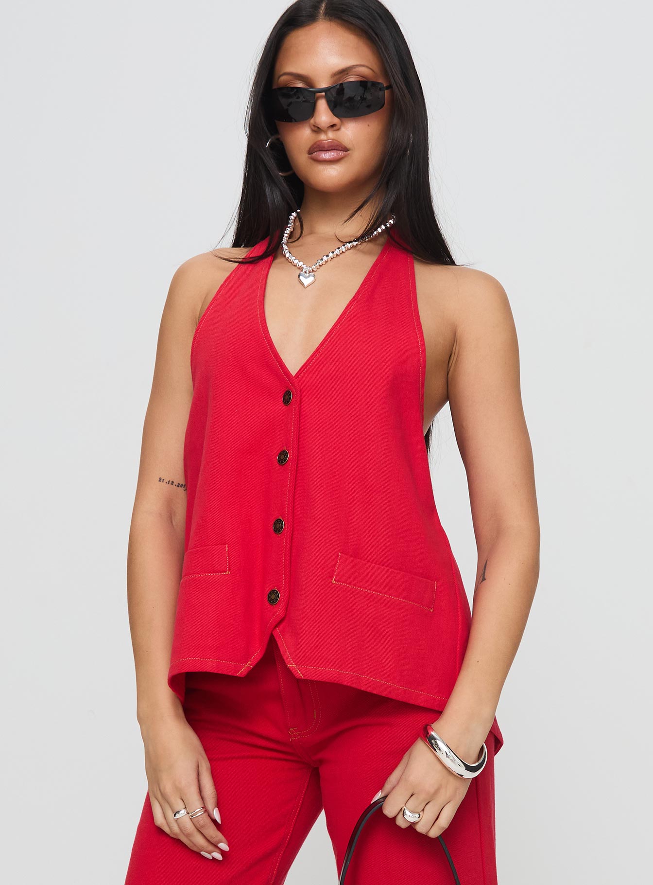 side view of model wearing Princess Polly Hills Halter Crimson Sleeveless V-Neck 