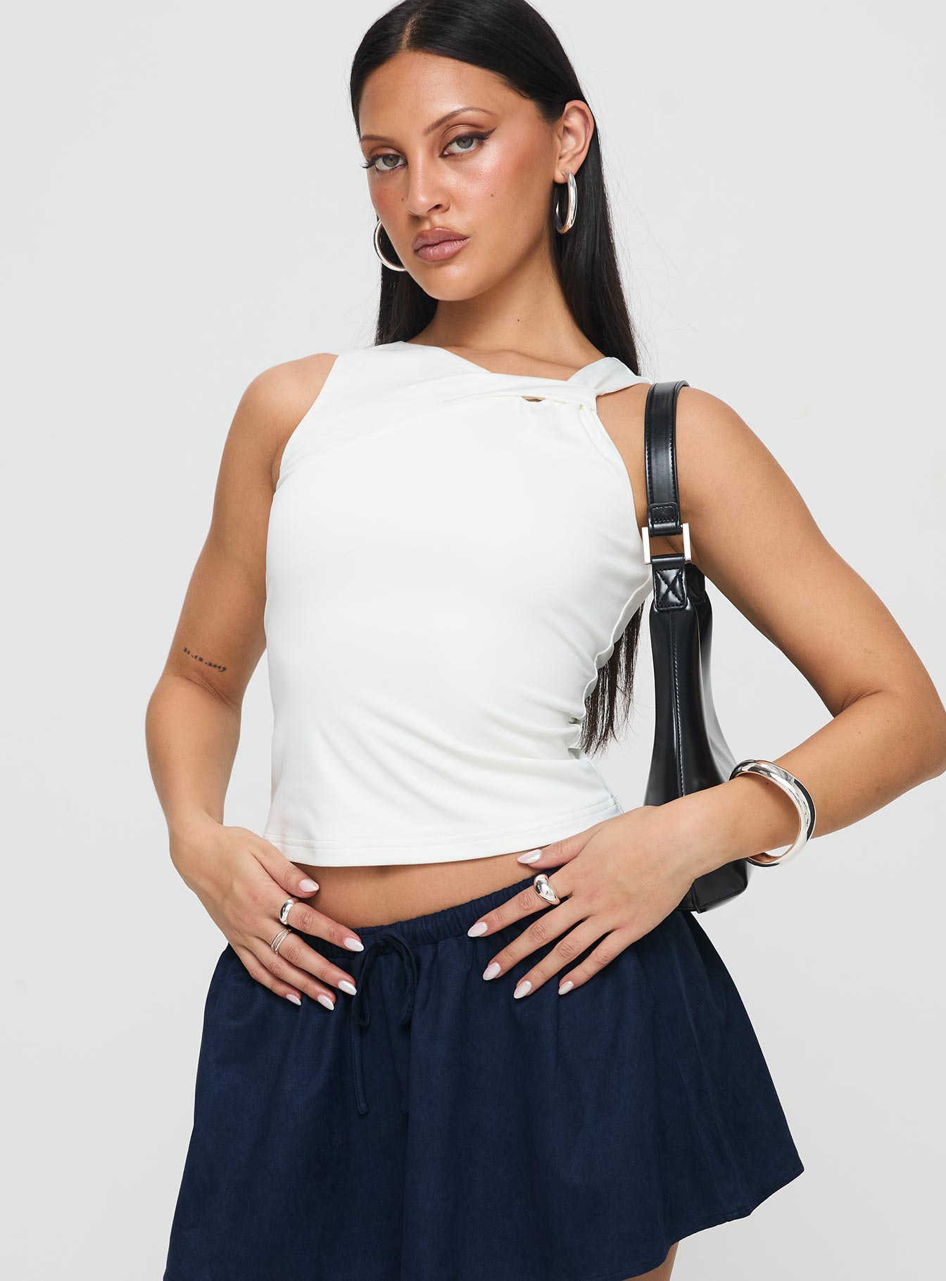 front view of model wearing Princess Polly Corcus Top White Sleeveless Asymmetric Neckline 
